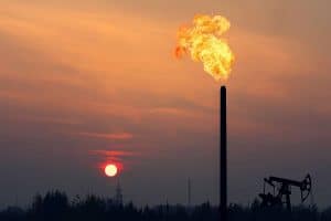 Oil drilling field with flaming Chimney